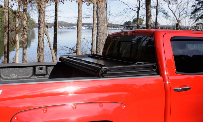 Lund 09-14 Ford F-150 Styleside (5.5ft. Bed) Hard Fold Tonneau Cover - Black