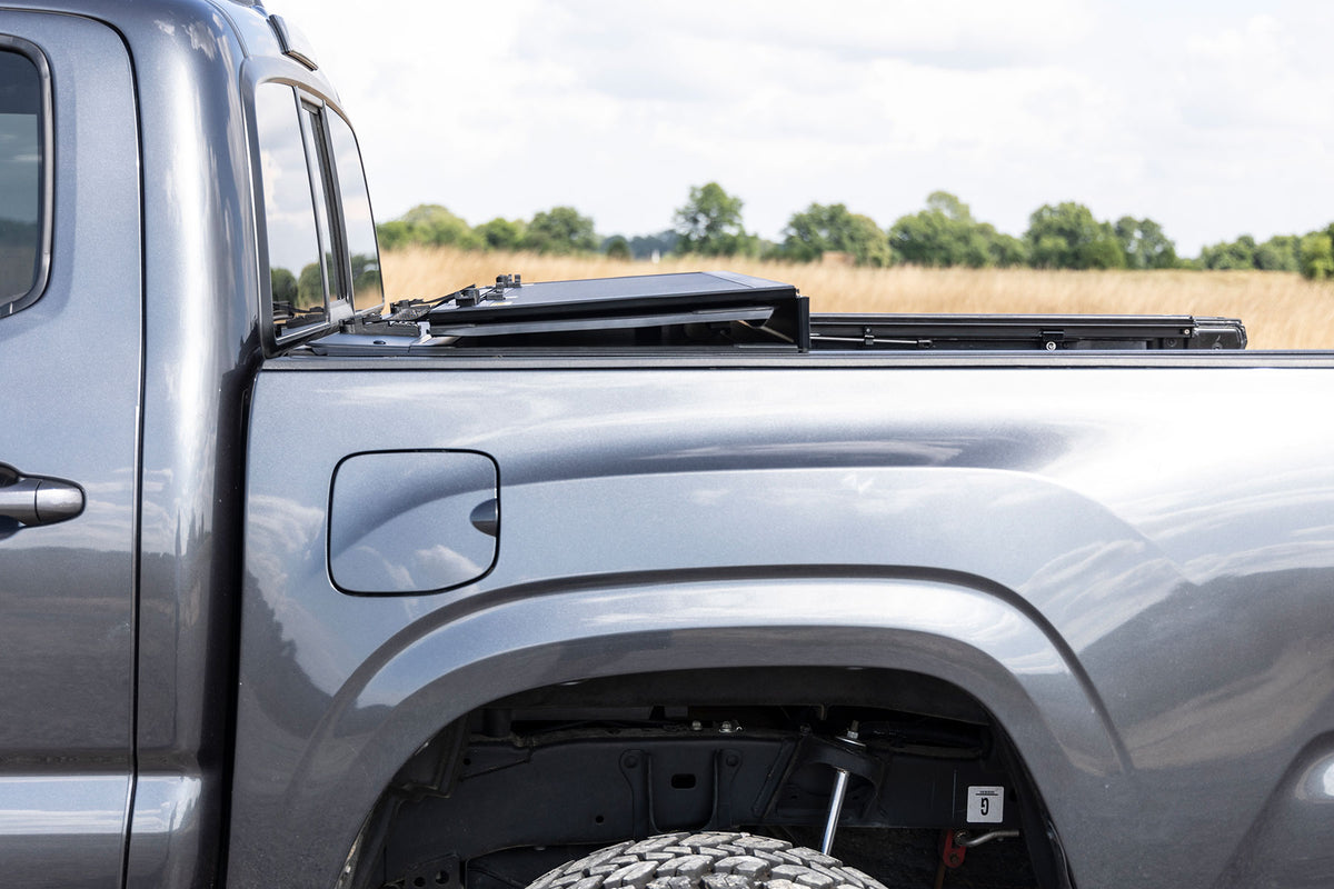 Rough Country Hard Tri-Fold Flip Up Bed Cover | Toyota Tacoma 2WD/4WD (16-23)