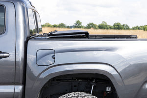 Rough Country Hard Tri-Fold Flip Up Bed Cover | Toyota Tacoma 2WD/4WD (16-23)