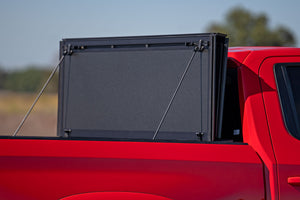 Rough Country Hard Tri-Fold Flip Up Bed Cover | Chevy/GMC Sierra 1500 (19-26)/Silverado 1500 (19-26)