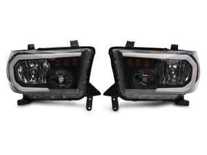 Raxiom 07-13 Toyota Tundra Axial Series Headlights w/ LED Bar- Black Housing (Clear Lens)