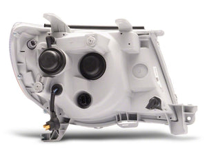 Raxiom 05-11 Toyota Tacoma Axial Series LED DRL Projector Headlights- Black Housing (Clear Lens)