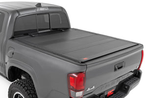 Rough Country Hard Tri-Fold Flip Up Bed Cover | Toyota Tacoma 2WD/4WD (16-23)
