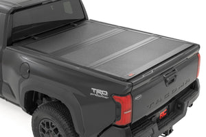 Rough Country Hard Tri-Fold Flip Up Bed Cover | Toyota Tacoma 2WD/4WD (2024-2026)