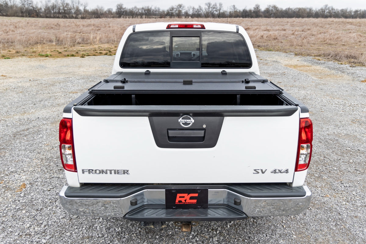 Rough Country Hard Tri-Fold Flip Up Bed Cover 5' Bed | Nissan Frontier 2WD/4WD (05-21)