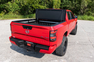 Rough Country Hard Tri-Fold Flip Up Bed Cover 5' Bed | Nissan Frontier 2WD/4WD (22-26)